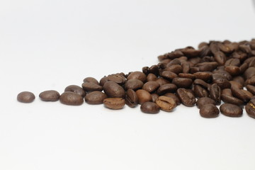 grains of black coffee flavored on the table