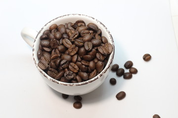 coffee beans in  white cup 