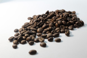 grains of black coffee flavored on the table