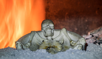 Fototapeta na wymiar burning skeleton in flaming fire, Halloween party
