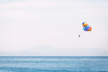 Parasailing at the mediterranean sea - extreme water sports and entertainment concept