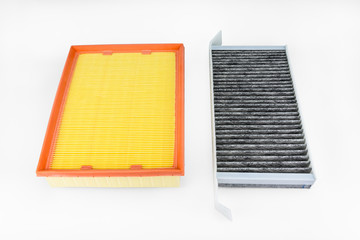 Rectangular, carbon cabin filter and air filter for car isolated on white background with clipping path.