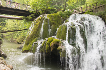 Save the environment, beautiful green park and forest with waterfall and small pure drinkable water creek, Romania, Bigar Cascade Falls, near Poneasca city, 04 June 2019