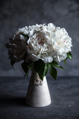 Beautiful peonies on grey concrete background. Wedding, birthday, valentine's day, women's day