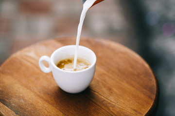 cup of coffee on wooden table