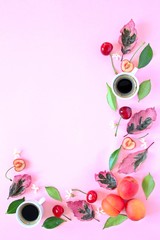 Coffee with fruits and follies on pink background. Top view with copy space. Flet lay style. Summer concept. © Ale02