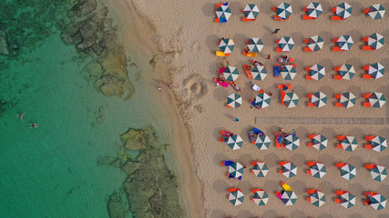 Aerial drone top view photo of turquoise organised beach forming a small heart shaped lagoon and mountainous seascape of Stavros, Chania, Crete island, Greece