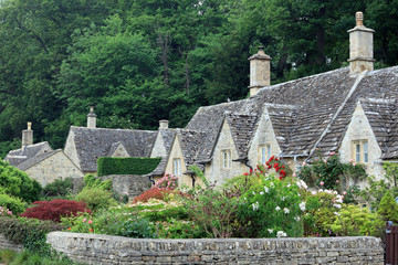 A Row Of Traditional Cotswold Stone Cottages In The Picturesque Village Of Bibury, England, UK