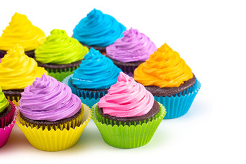Rainbow Colored Frosted Chocolate Cupcakes on a White Background