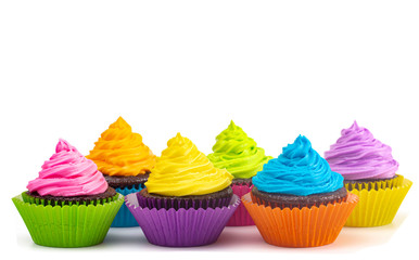 Rainbow Colored Frosted Chocolate Cupcakes on a White Background
