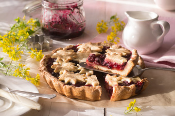 Cherry tart on wooden table