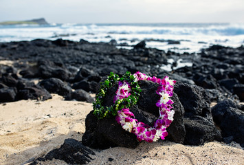 Wedding Leis on Rocks at Oahu Hawaii Beach