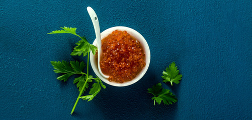 banner of portion of red caviar on the table