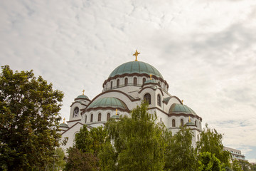 Fototapeta na wymiar St Sava Cathedral against clouds in Belgrade Serbia