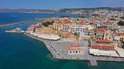Fototapeta na wymiar Aerial drone panoramic view of iconic and picturesque Venetian old port of Chania with famous landmark lighthouse and traditional character, Crete island, Greece