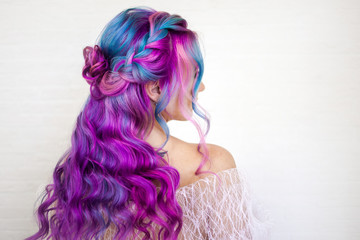 Stylish fashionable young woman with bright hair coloring, Magenta and purple.
