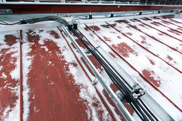 Cable tray outside with telecommunications cables, optic fiber, power cables and transmitter data...