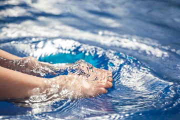 Foto op Plexiglas children foot swimming pool background   © jonicartoon