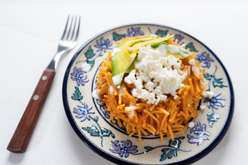 Mexican fideos dry soup with avocado and cheese
