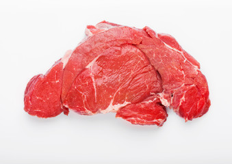 Fresh raw organic slice of braising steak fillet on white background.