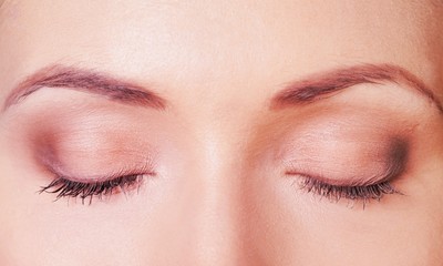 Naklejka premium Close-up of a Woman with Eyes Closed