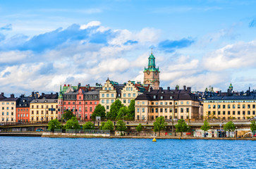 Fototapeta na wymiar Urban landscape of colorful houses from the old town of Gamla Stan on Lake Malaren Riddarfjarden waterfront in Stockholm, Sweden