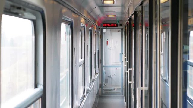 Empty corridor in the train cabin while traveling in 4k slow motion 60fps