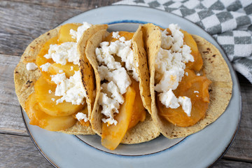 Mexican potato stew tacos with fresh cheese