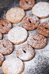 Chocolate chip and oat fresh cookies with sugar powder closeup.