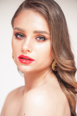 Fototapeta na wymiar Beauty Makeup. Woman With Beautiful Face And Pink Lips. Close Up Of Beautiful Young Elegant Female Model With Glamorous Sexy Makeup, Soft Smooth Skin And Plump Full Pink Lips. High Quality Image. 
