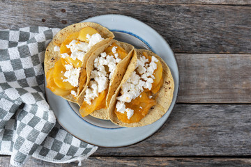 Mexican potato stew tacos with fresh cheese