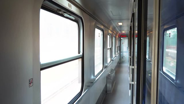 Empty corridor in the train cabin while traveling in 4k slow motion 60fps