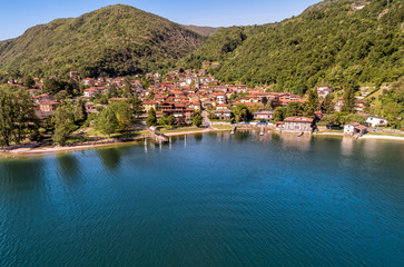 Fototapeta na wymiar Aerial view of small village Brusimpiano located on the shore of lake Lugano, Italy