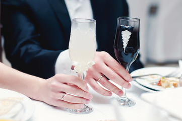 Glasses bride and groom on the holiday table. Holiday. Wedding.