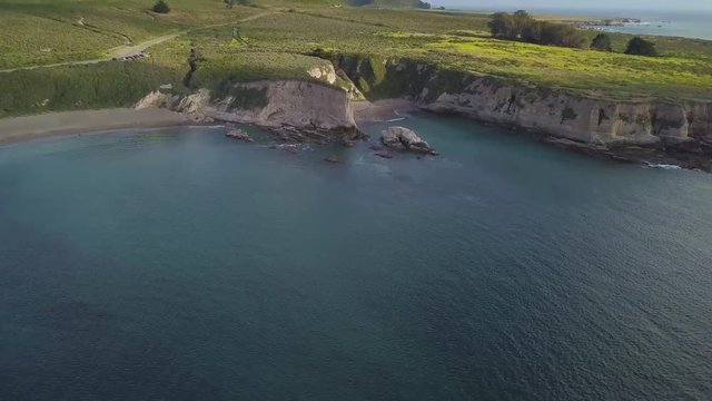303 Big Sur aerial revealing the ocean cliffs beach mountain and clouds