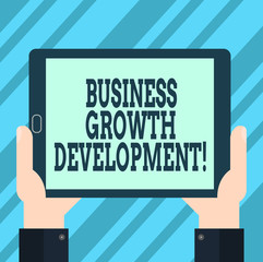 Text sign showing Business Growth Development. Conceptual photo improving some measure of an enterprise success Hu analysis Hand Holding Blank Screen Tablet Smartphone Display Unit photo