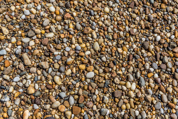 rocks obfuscating the sand on a sunny beach