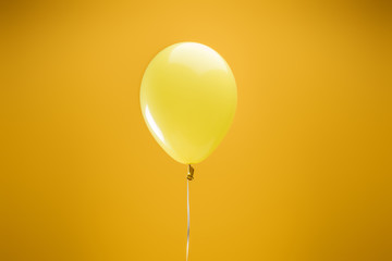 festive bright minimalistic decorative balloon on yellow background