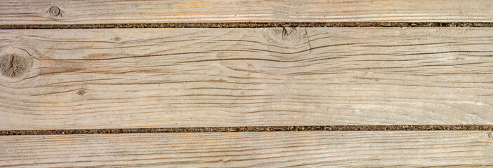 Fototapeta premium texture of antique floorboards, old dried wood with a lot of cracks and peeling fibers, closeup abstract background