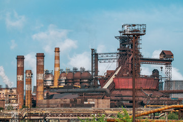 Metallurgical factory with chimneys and smog. Industrial plant for steelworks, ironworks or...