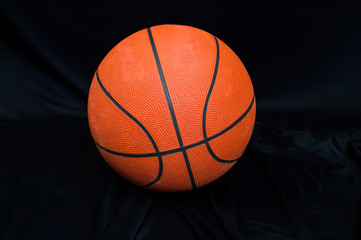 Basketball on the black cloth and background