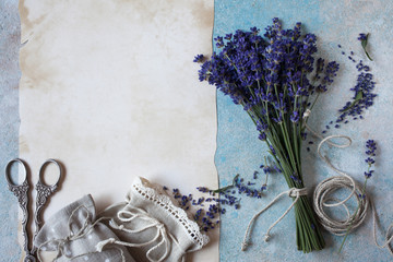 Background with lavender flowers, sachet bags and paper for text
