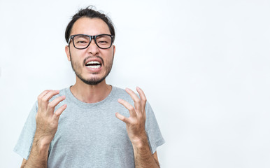 Portrait of angry pensive mad crazy asian nerd glasses man screaming out. Closeup Young asian nerdy man isolated on white background. Stress burnout office syndrome over load work hard male concept