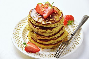 Paleo hazelnut pancakes with honey and strawberry. Gluten and sugar free pancakes