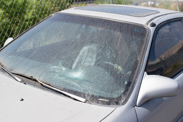 Car cracked or broken windshield.