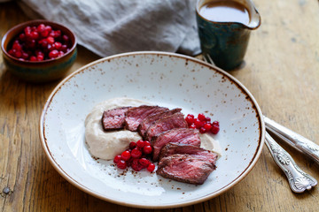 Venison with chestnut puree and lingonberries
