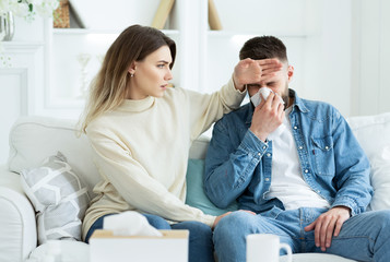 Woman Taking Care Of Her Ill Husband