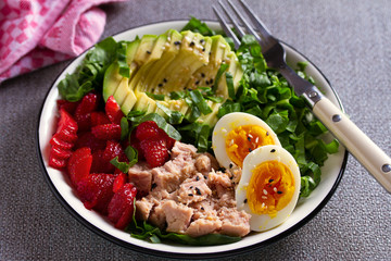 Tuna strawberries avocado egg and spinach salad. Tuna fish salad