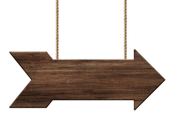 Wooden arrow shape signpost or signboard made of dark wood hanging on ropes