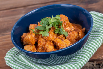 indian butter chicken dish with cilantro on top